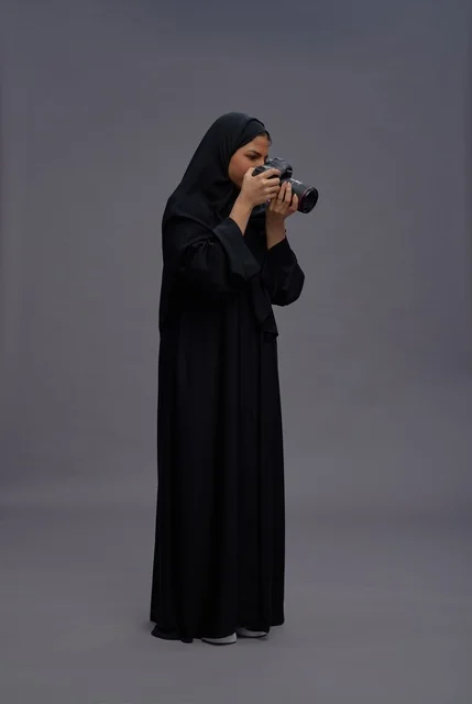 Saudi Woman with Professional Camera in Studio