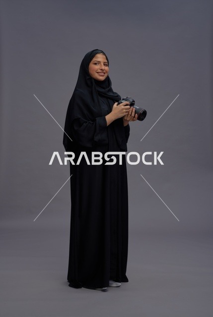 Saudi Woman with Professional Camera in Abaya