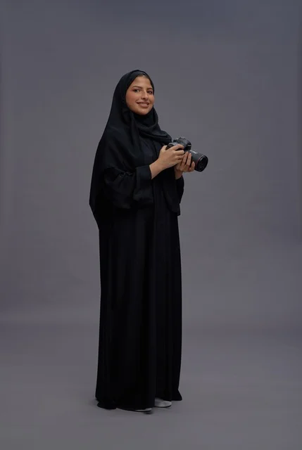 Saudi Woman with Professional Camera in Abaya Saudi Woman with Professional Camera in Abaya