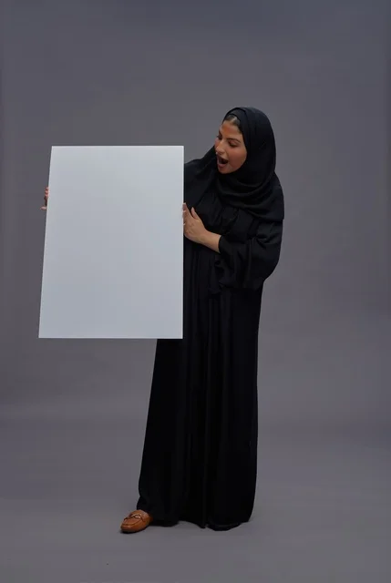 Saudi Woman in Black Abaya Holding Blank White Board