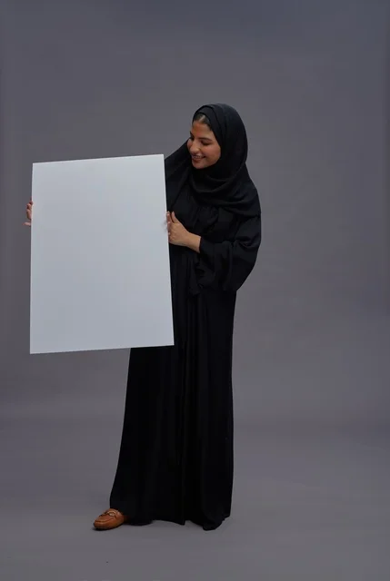 Saudi Woman in Black Abaya Holding Blank White Board