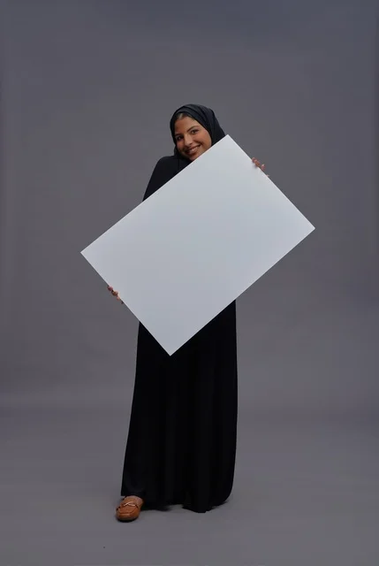 Saudi Woman in Black Abaya Holding Blank White Board