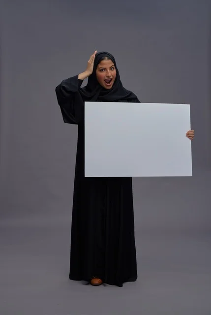 Saudi Woman in Black Abaya Holding Blank White Board