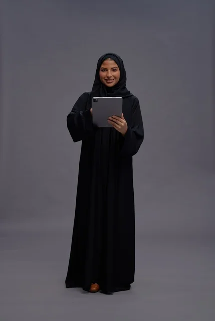 Saudi Woman Using Digital Tablet in Studio
