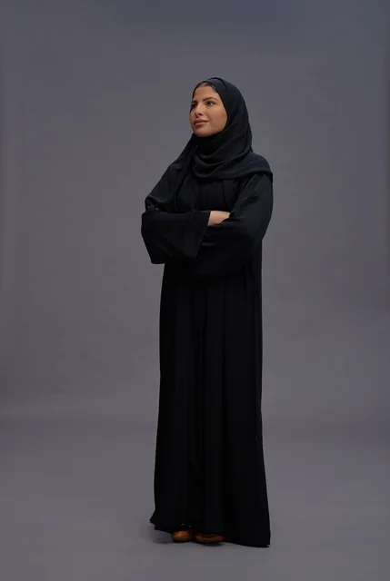 Saudi Woman in Black Abaya Posing with Crossed Arms