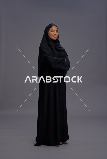 Saudi Woman in Black Abaya on Grey Background