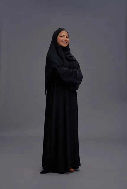 Saudi Woman in Abaya Standing Confidently in Studio