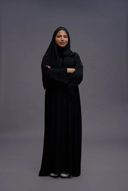 Saudi Woman in Black Abaya Standing in Studio