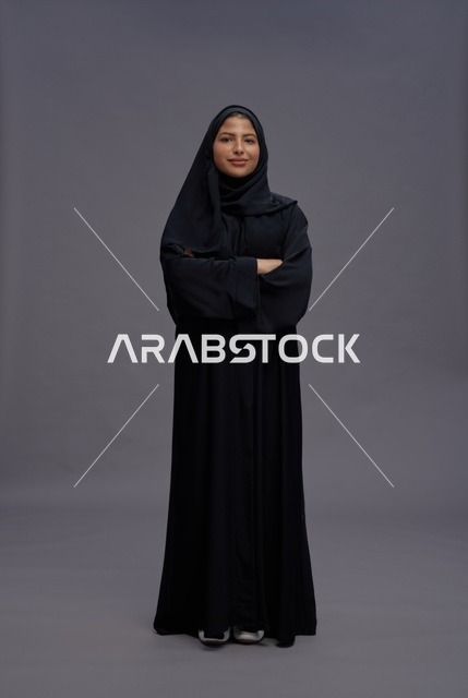 Saudi Woman in Black Abaya Standing with Arms Crossed