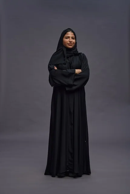 Saudi Woman in Black Abaya Standing in Studio