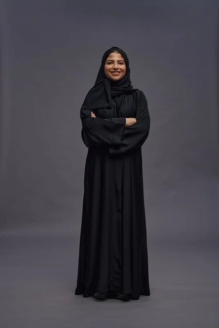 Saudi Woman in Abaya Standing with Crossed Arms