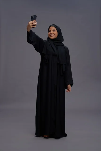 Saudi Woman in Black Abaya Taking Smartphone Selfie