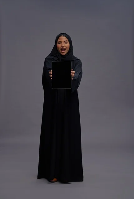 Saudi Woman Holding Tablet with Blank Screen