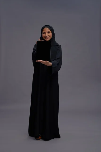 Saudi Woman in Abaya Holding Blank Tablet Screen