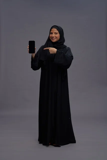 Saudi Woman Pointing at Blank Smartphone Screen