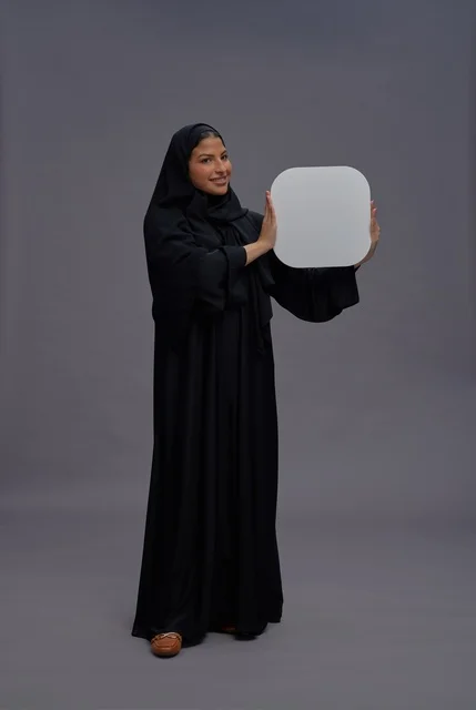 Saudi Woman Studio Portrait Holding Blank White Board