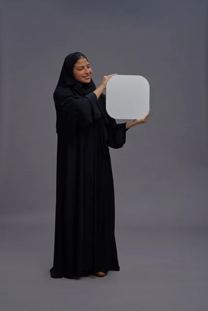 Saudi Woman in Abaya Holding Blank White Board