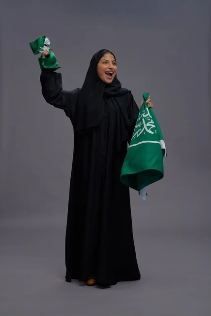 Saudi Woman Holding National Flag Celebration Studio Shot