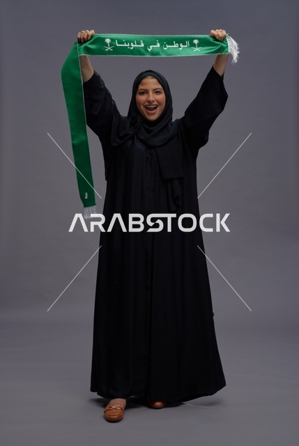 Saudi Woman with National Scarf on Gray Background