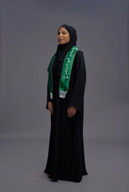 Saudi Woman in Abaya with National Green Scarf