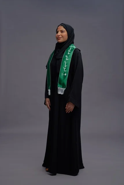 Saudi Woman in National Scarf on Grey Background