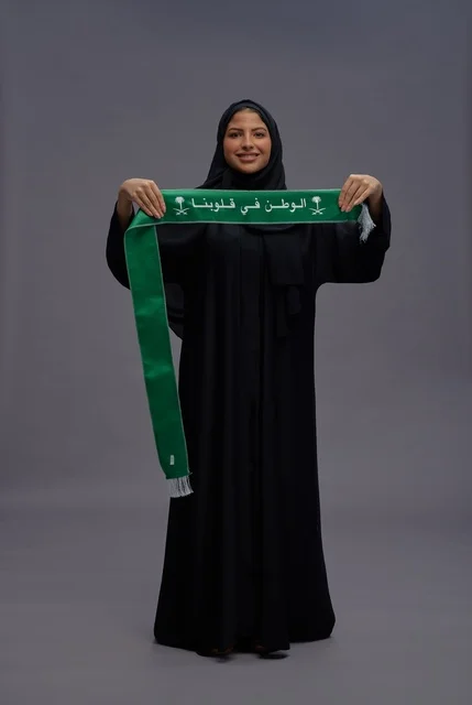 Saudi Woman Holding National Scarf on Grey Background