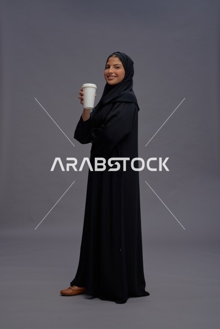 Saudi Woman Wearing Abaya Holding Coffee Cup