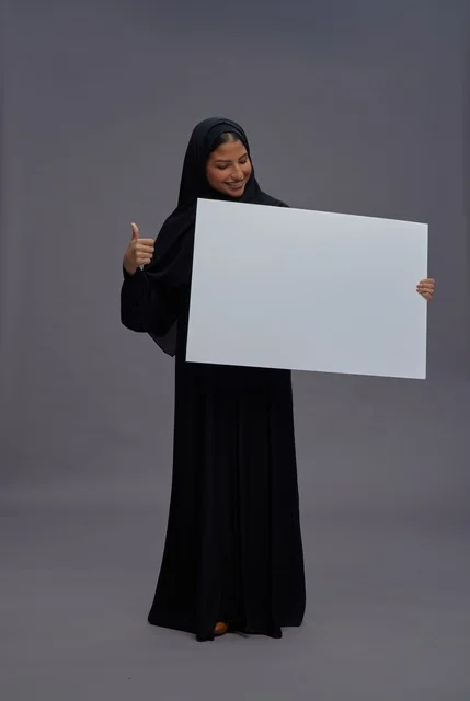Saudi Woman in Black Abaya Holding Blank White Board