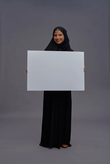 Saudi Woman in Black Abaya Holding Blank White Board