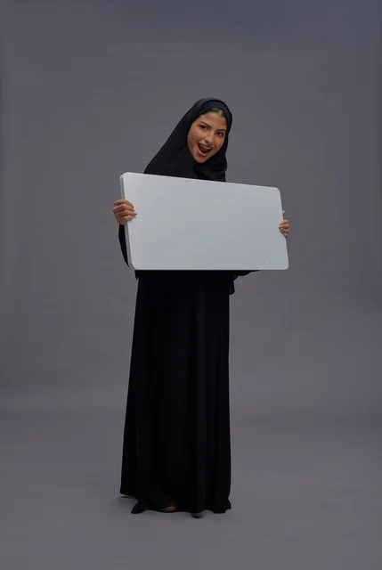 Saudi Woman in Black Abaya Holding Blank White Board
