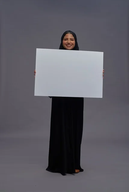 Saudi Woman in Abaya Holding Blank White Placard