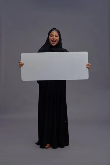 Saudi Woman in Black Abaya Holding Blank White Board