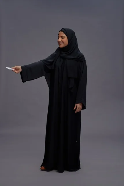 Saudi Woman in Black Abaya Holding Blank Card