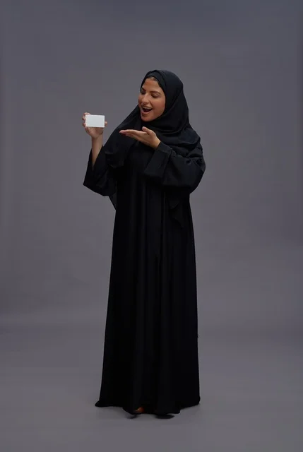 Saudi Woman in Black Abaya Holding Blank Card