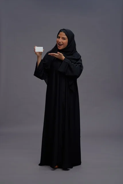 Saudi Woman in Black Abaya Holding Blank White Card