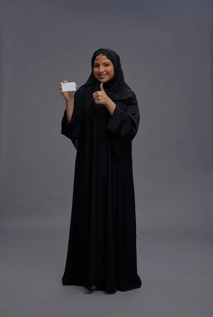 Saudi Woman in Black Abaya Holding Blank Card