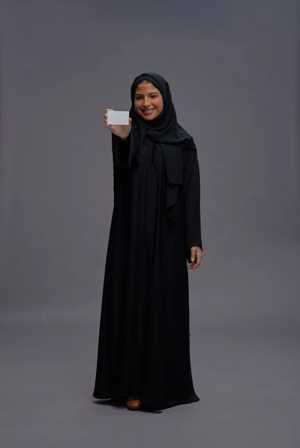 Saudi Woman in Black Abaya Holding Blank Card