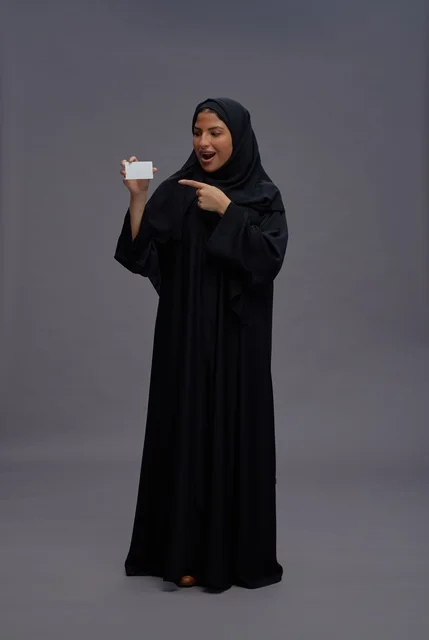 Saudi Woman in Black Abaya Holding Blank Card