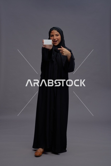 Saudi Woman in Black Abaya Holding Blank Card