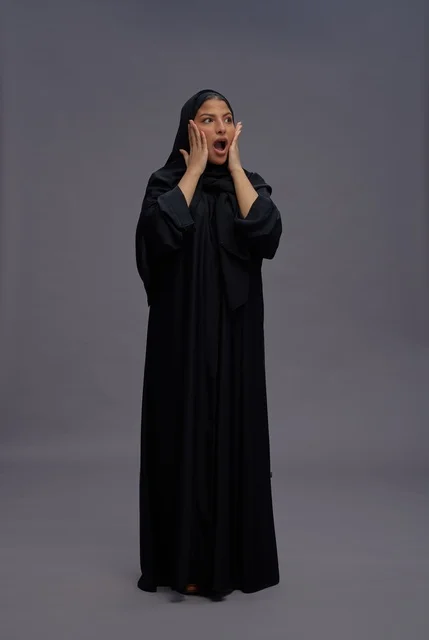 Saudi Woman in Black Abaya with Excited Expression