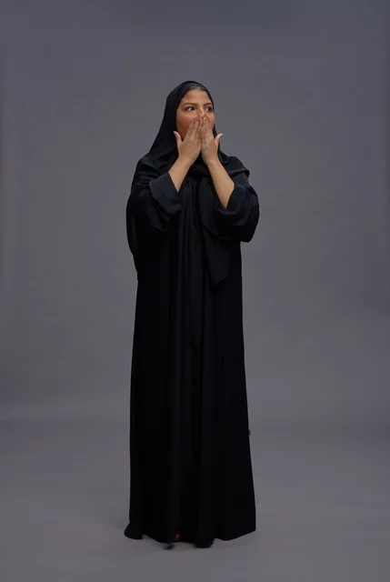 Saudi Woman in Black Abaya with Surprised Expression
