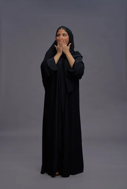 Surprised Saudi Woman in Black Abaya Studio Shot