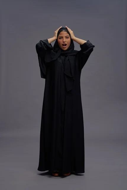 Saudi Woman in Black Abaya with Shocked Expression