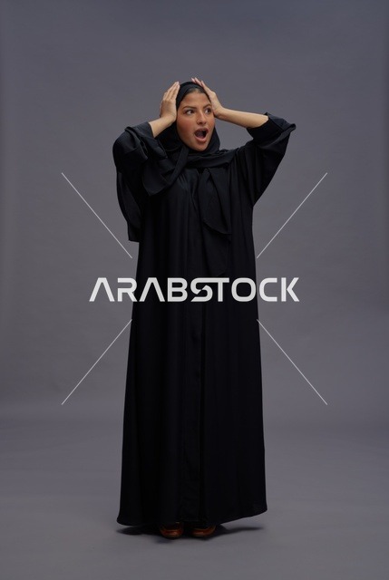 Surprised Saudi Woman in Black Abaya Studio Shot