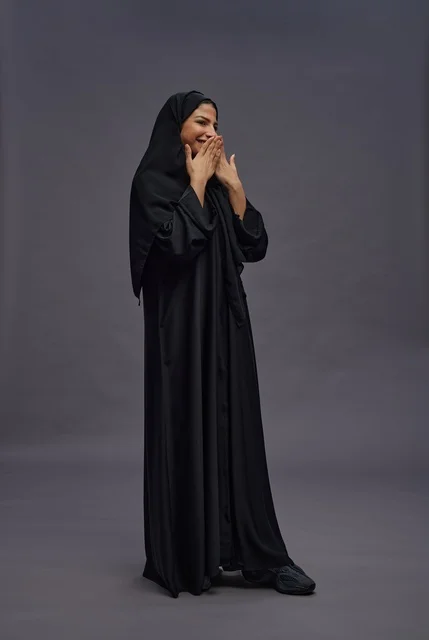 Saudi Woman in Black Abaya Cheerful Studio Portrait