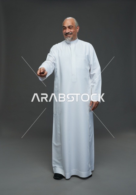Elderly Saudi Man with Car Key in Studio