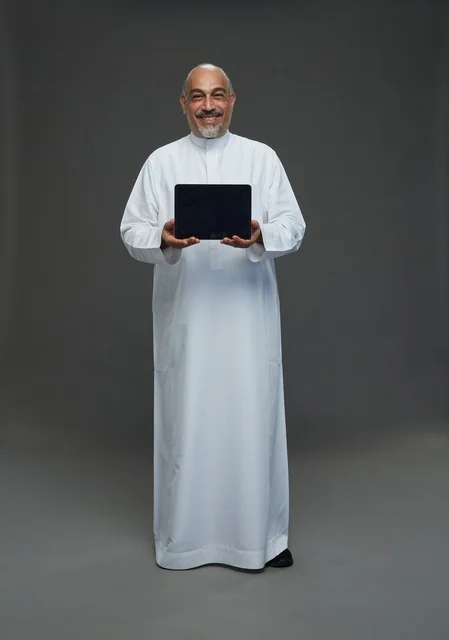 Senior Saudi Man Holding Digital Tablet in Studio