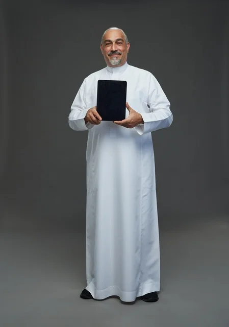 Elderly Saudi Man Holding Digital Tablet Studio Portrait