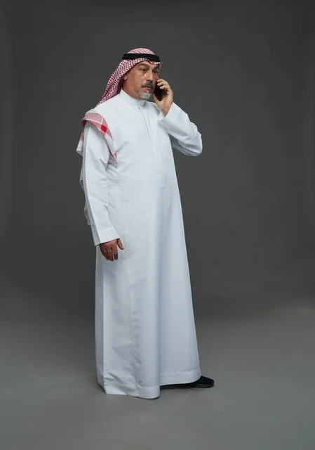 Elderly Saudi Man Talking on Smartphone in Studio