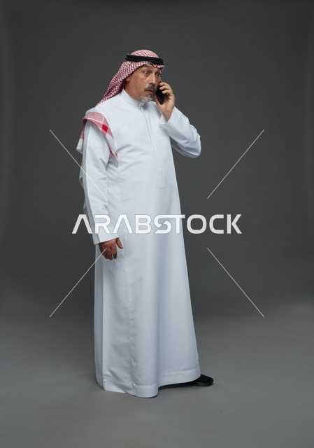 Elderly Saudi Man Talking on Smartphone in Studio